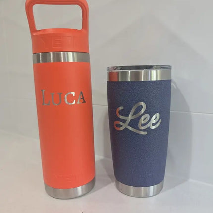 a red yeti drinkbottle engraved with 'luka' and a blue yeti cup engraved with lee