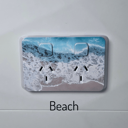 Clipsal iconic coverplate with a beach printed on it