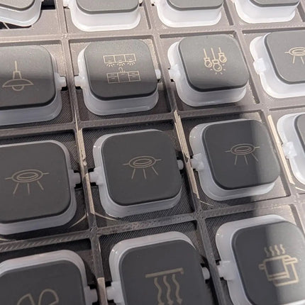 Clipsal Iconic dolly rockers in anthracite engraved with pictograms