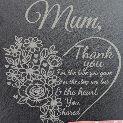 Engraved slate with a floral design and a heartfelt message to Mum, indicating love and appreciation.