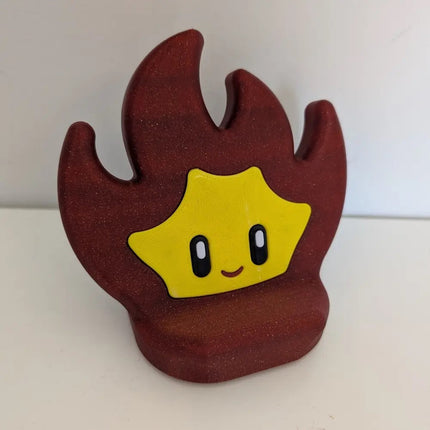 flame phone stand with a smiling face on a white background