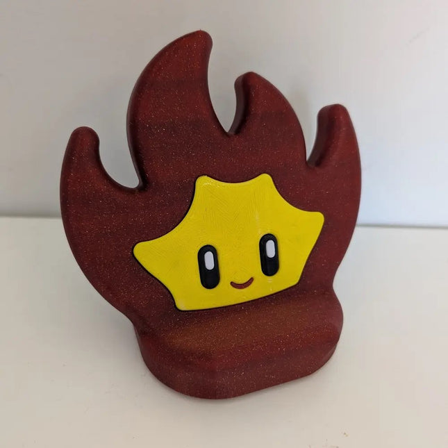 flame phone stand with a smiling face on a white background