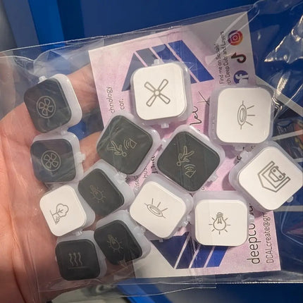 Mix of black and white dolly rockers engraved with pictograms ion vivid white and anthrcite