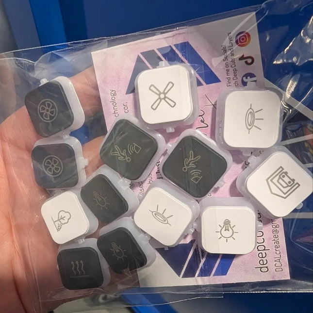 Mix of black and white dolly rockers engraved with pictograms ion vivid white and anthrcite