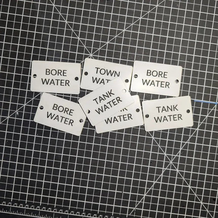 Set of labels indicating 'Bore Water' and 'Tank Water' on a grid background