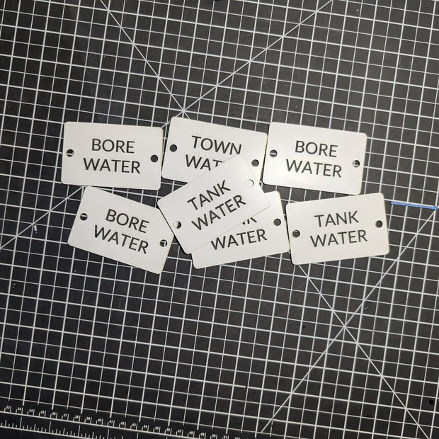 Set of labels indicating 'Bore Water' and 'Tank Water' on a grid background