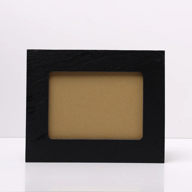 A rectangular black Slate picture frame with a textured finish and a tan insert, standing upright on a white surface against a white background.