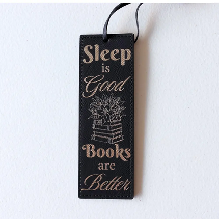 black leather Bookmark with text 'Sleep is Good, Books are Better' engraved in gold 