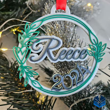 Green Vine designed christmas bauble with the name 'reece' and the year 2024