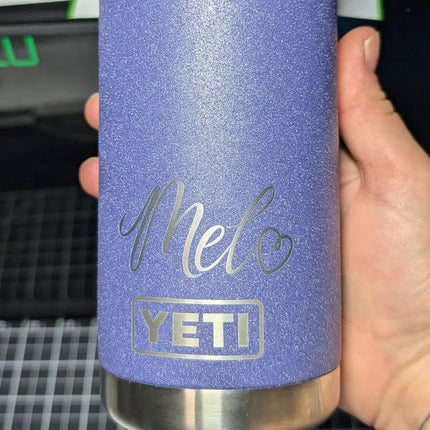 Purple Yeti water bottle engraved with cursive writing
