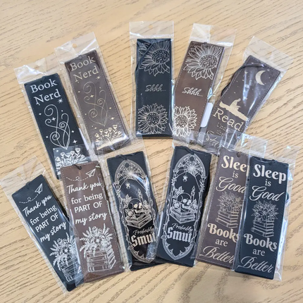 Set of leather engraved bookmarks in clear packaging
