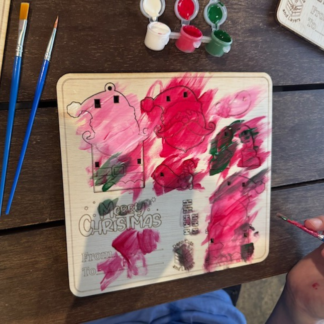 One of the christmas boards semi painted by Ella