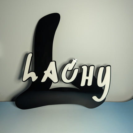 Black and white text 'LACHY' made out of 3mm acrylic