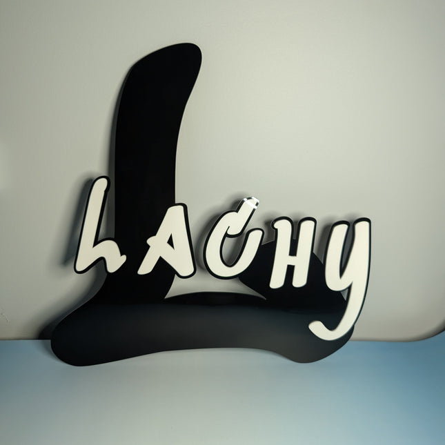 Black and white text 'LACHY' made out of 3mm acrylic