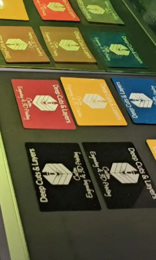 Colorful busieness cards with text and symbols on a green background